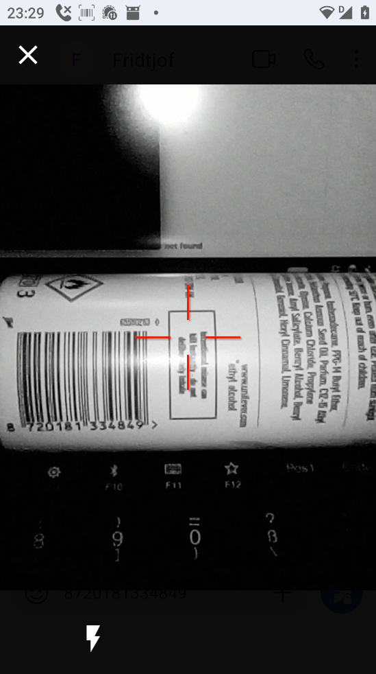 The barcode scanner viewfinder, showing a grayscale view of a can of deodorant. There is a red crosshair almost pointing at the can's barcode (but not quite, to avoid scanning it). On the bottom left, there is a button to toggle a flashlight dedicated to the barcode scanner camera. 
